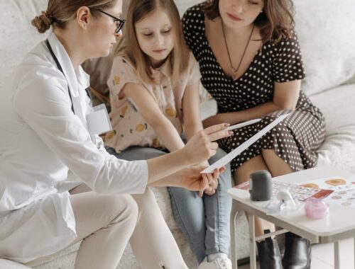 a doctor checking a child